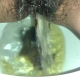 From under the toilet, a very cute girl pushes out a long hanging log that drops, then pisses over the product. Filmed from a between the legs perspective. Vertical format video. Under a minute.